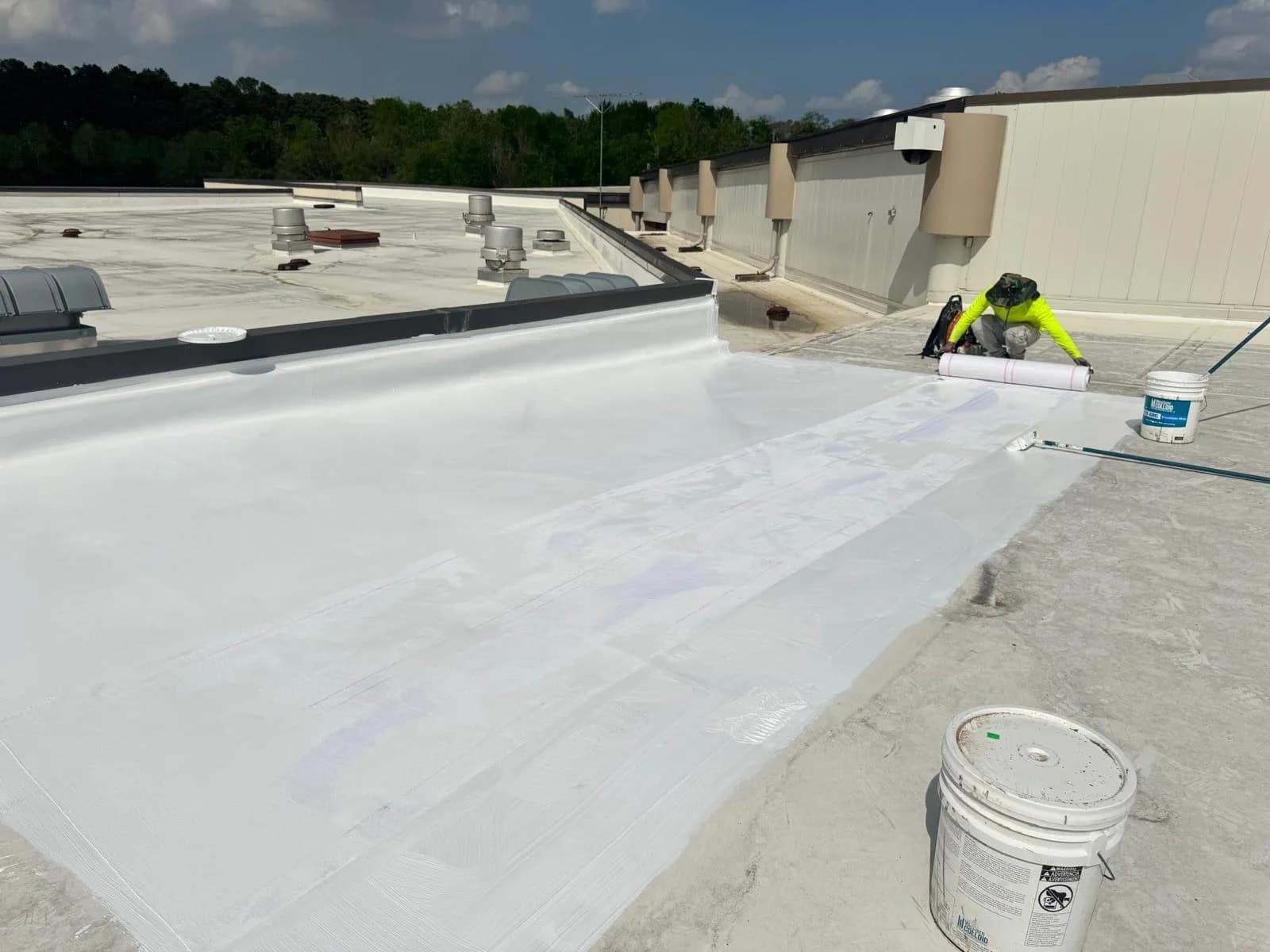 Freshly restored white membrane across a commercial roof