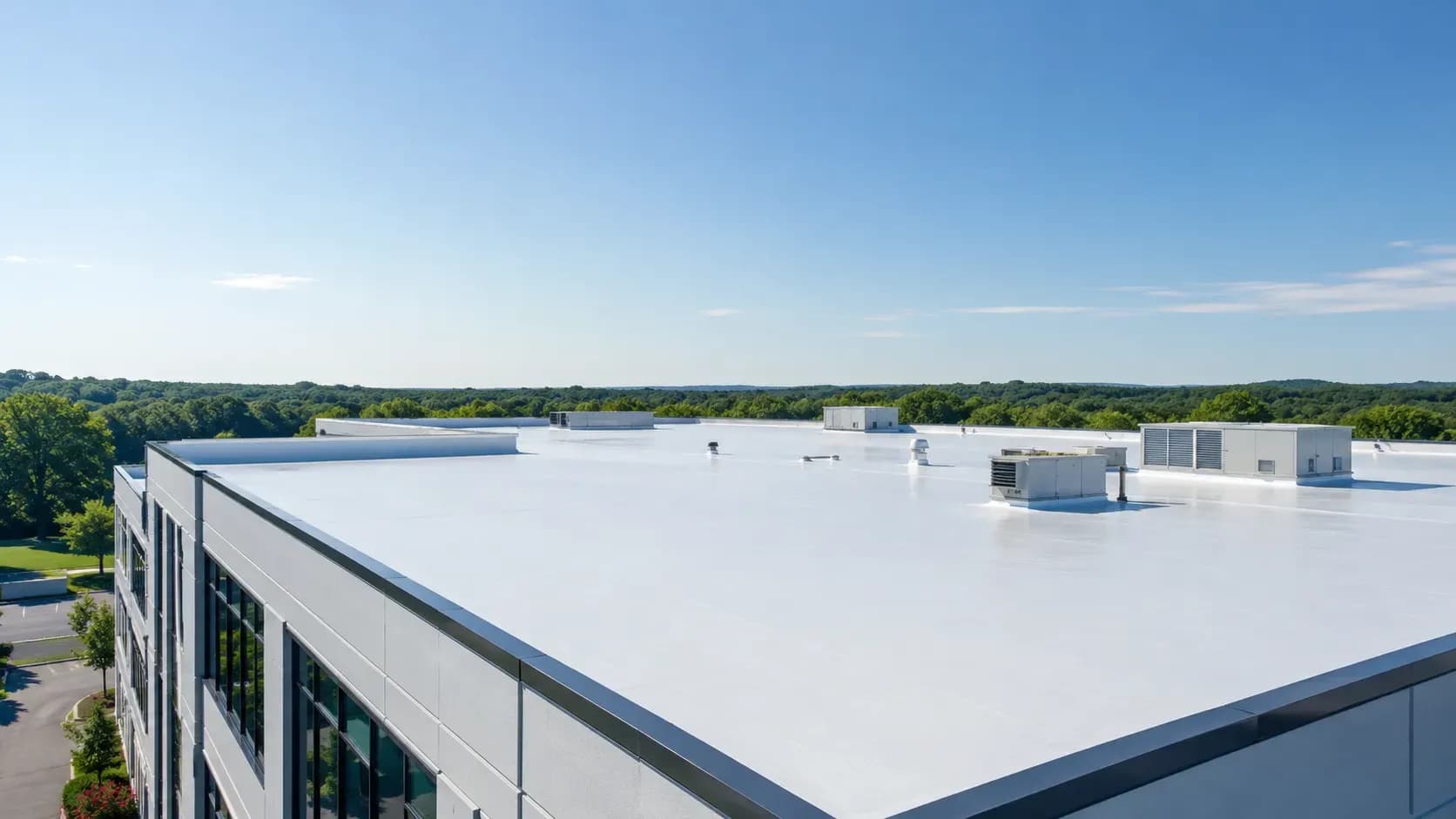 Daylight over the parapet and stair tower of a commercial roof